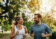 © Running opossum - Young couple jogging and laughing together in a park, enjoying their healthy lifestyle