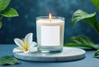 © MarGa - White candle and lily with greenery on a marble base against a blue background, conveying tranquility, purity, and a fresh ambiance, suitable for wellness themes