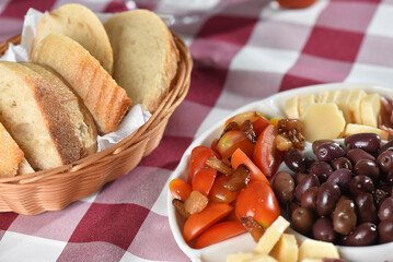 portion of olives with cheese cherry tomatoes and parma ham snack healthy food vegan salad