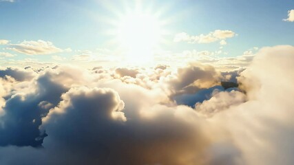 Wall Mural - 4K loop fluffy cumulus clouds drifting warm rays sun bright daylight shining casting shadows rolling offering serene peaceful sky scene