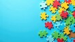 © Helga P-A. - Colorful puzzle pieces scattered on a blue background represent the multifaceted nature of autism and the search for understanding. Concept of autism rights movement. World Autism Awareness Day