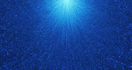 Wall Mural - a vibrant digital scene featuring dense blue particles radiating from a bright central light source,
