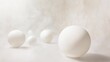 © Chaikit - Ethereal expanse of perfectly spherical white orbs, suspended in a gossamer mist. Soft, neutral backdrop adds depth, creating an illusion of infinite space. Subtle gradients and highlights imbue each