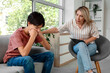 © Pixel-Shot - Female psychologist working with upset teenage boy in office