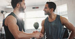 © peopleimages.com - Fitness, men and handshake in gym for workout success, wellness challenge or training teamwork. Athlete, personal trainer or hand gesture at sports center for exercise progress or performance support