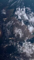 Wall Mural - Vertical Shot of the UK Seen from Space with City Night Lights as Dawn Breaks