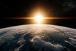 © Ilona - A view of the sun rising over the earth from space