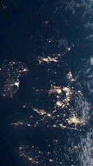 Wall Mural - Vertical Aerial Shot of the UK Seen from Space as the Sun Rises