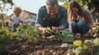 © Thanaporn - Veterans and families at a community garden, planting and nurturing plants together