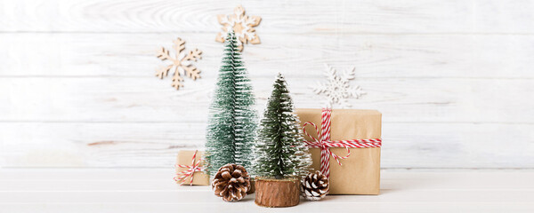 Wall Mural - Christmas composition. Gifts, small tree, branches and craft DIY decorations on white background. New year concept. Christmas home decoration Flat lay, top view, copy space