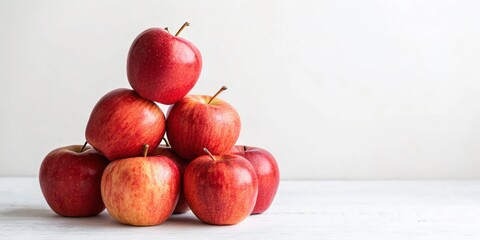 Wall Mural - Pile of Fresh Red Apples on a Simple White Background - Perfect for Minimalist Photography and Food Styling in Stock Imagery