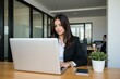 © NeedMoreMars - Professional Woman Working on Laptop in Modern Office Setting, Ideal for Business and Technology Websites