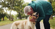 © peopleimages.com - Training, dog and kiss with old man in park for walking, adventure and playing fetch. Animal care, support and morning with person and Labrador pet in nature for bonding, guide and wellness together