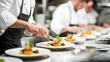 © Kenn W. - Skilled professional chefs meticulously preparing and plating signature dishes in a gourmet kitchen, showcasing culinary artistry and attention to detail for food enthusiasts.