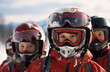 © Katewaree - Close-up of young skiers in winter gear, ready for skiing adventure on snowy mountain slopes.