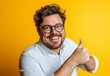 © FreyStudios - A Joyful Man with a Thumbs Up - A Positive and Confident Portrait, people expression series