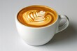 © Vii - A cup of coffee with a creative leaf design on the side