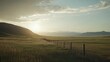 © Pumapala - A serene landscape at sunset with rolling hills and a fence line.