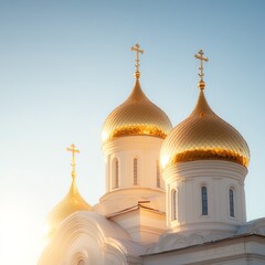 Beautiful church domes illuminated by sunlight under a clear blue sky.