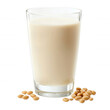 © kiimoshi - Delicious and creamy soy milk in a clear glass with soybeans in the foreground.