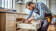 © Tekin - Male Carpenter Installing Drawer