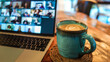 © Mirjana - A lively online meeting with coffee on a wooden table, showcasing participants engaging from various locations in a collaborative atmosphere