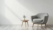 © Петро Зигмунд - Cozy gray armchair beside a modern wooden table with greenery, set in a bright, minimalist room.