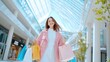 © Prompt2image - A cheerful young woman smiles as she walks through a contemporary shopping mall, carrying several brightly colored bags and enjoying a day out