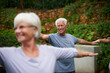© peopleimages.com - Park, senior or man in yoga class for stretching arms, balance or inner peace in nature. Group meditation, smile or happy elderly person with old people for spiritual healing, energy or mindfulness