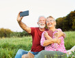 © Lumos sp - woman man outdoor senior couple happy lifestyle retirement together smiling love selfie camera mature