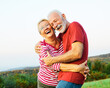 © Lumos sp - woman man outdoor senior couple happy lifestyle retirement together smiling love hug nature mature