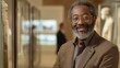 © gn8 - Portrait of a mature black man in a professional setting with salt and pepper beard
