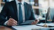 © Prompt2image - A well-dressed individual is diligently examining legal documents on a desk, holding a tablet in one hand, while a scale of justice symbolizes the legal profession nearby