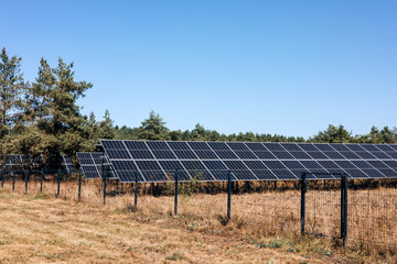 Large panels of sleepy batteries outside. Alternative electricity, green economy. Background with solar panels. Front view