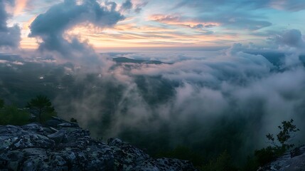 Canvas Print - A breathtaking panoramic view of rolling hills and clouds at sunset, showcasing nature's beauty.