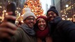 © fotofabrika - Three friends take a selfie in front of a brightly lit Christmas tree in a city setting