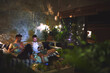 © R Jordaan/peopleimages.com - Night, phone and men on sofa together for browsing, relax and bonding in home with mobile app. Weekend, hangout and friends with smartphone, social media search and beer on couch in dark living room