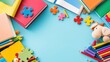 © bteeranan - Colorful Children's Storybooks, Crayons, and Puzzles Laid Out on a Blue Background for Creative and Educational Activities