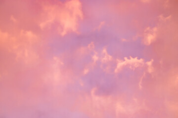 Wall Mural - a beautiful sky tinted by the sun leaving vibrant shades of gold, pink, blue and multicolored. cloud