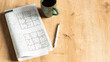 © busra - crossword paper with pen and coffee cup