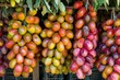 © juliars - Bunches of colorful dates hanging and drying in preparation to be sold at a market