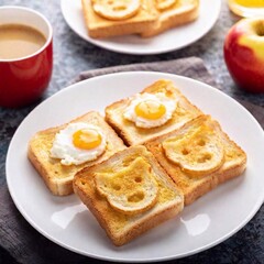 Wall Mural - A breakfast spread for kids with toast cut into animal shapes, scrambled eggs with a sprinkle of cheese, and a side of apple slices