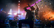 © Gorodenkoff - Indie Rock Band Delivers a Beautiful Live Performance With Guitars and Drums at a Modern Nightclub with Glittering Confetti. Colorful Lights and Powerful Sound at a Rock Festival