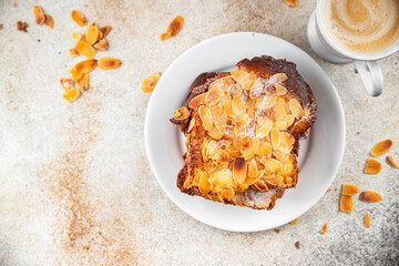 Wall Mural - Brioche sweet almond french toast fresh tasty food dish delicious gourmet food background on the table rustic food top view copy space