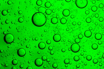 Wall Mural - Green macro drink bubble texture,Macro bubble texture green,Close up macro Aloe vera gel serum cosmetic texture green background with bubbles. Cruelty free. Lemongrass gel skincare product. antibacter