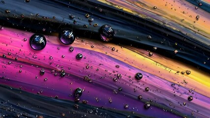 Wall Mural - Water droplets rest on a vibrant painted surface, creating a colorful abstract design