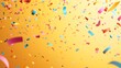 © Nicolai - Colorful confetti falling on a yellow background