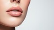 © Phatharaporn - Close-up action of glossy lips studio beauty photography minimalist background portrait view modern aesthetic