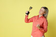 © New Africa - Happy winner with golden trophy cup on yellow background, space for text