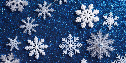 Wall Mural - magical white snowflakes over glitter blue dark background